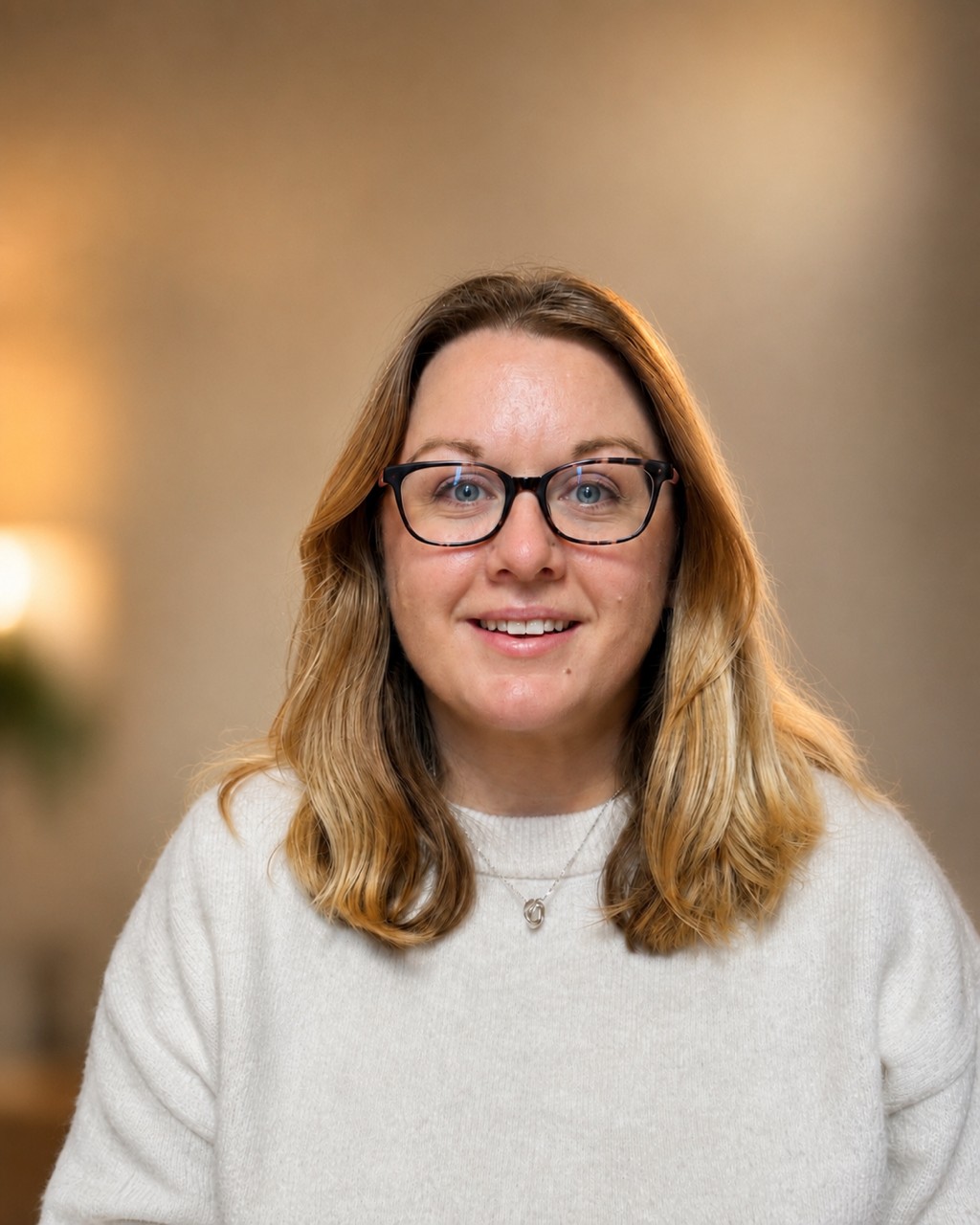 A headshot of Katie