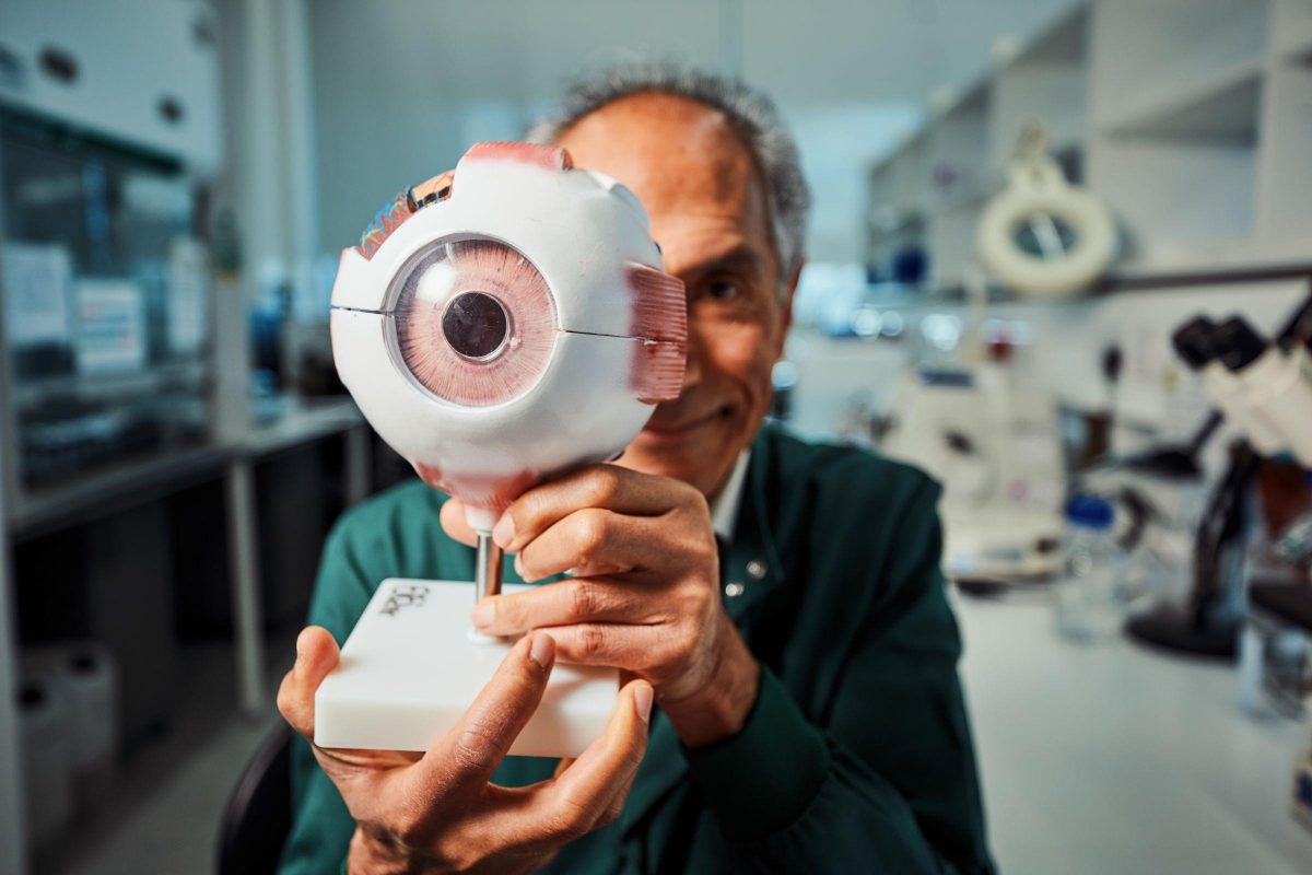 Prof Baljean Dhillon Scone Project Image Credit Andrew Perry. The Professor's face is part obscured by a 3D model of an eye. 