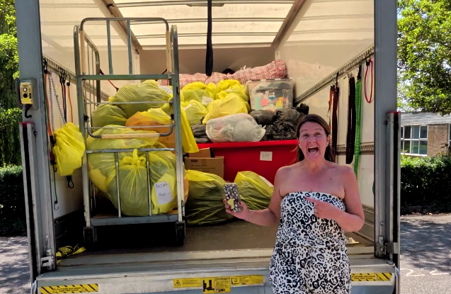 Emma Excited At her Fight for Sight Donations Drive - standing in front of a huge van of donation that will help fund sight loss research