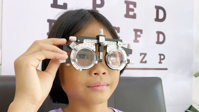 Young girl having an eye test 