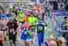 Runners taking part in the Rob Burrow Leeds Marathon, including people wearing fancy dress