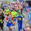 Runners taking part in the Rob Burrow Leeds Marathon, including people wearing fancy dress
