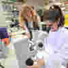A researcher and student working together in the lab