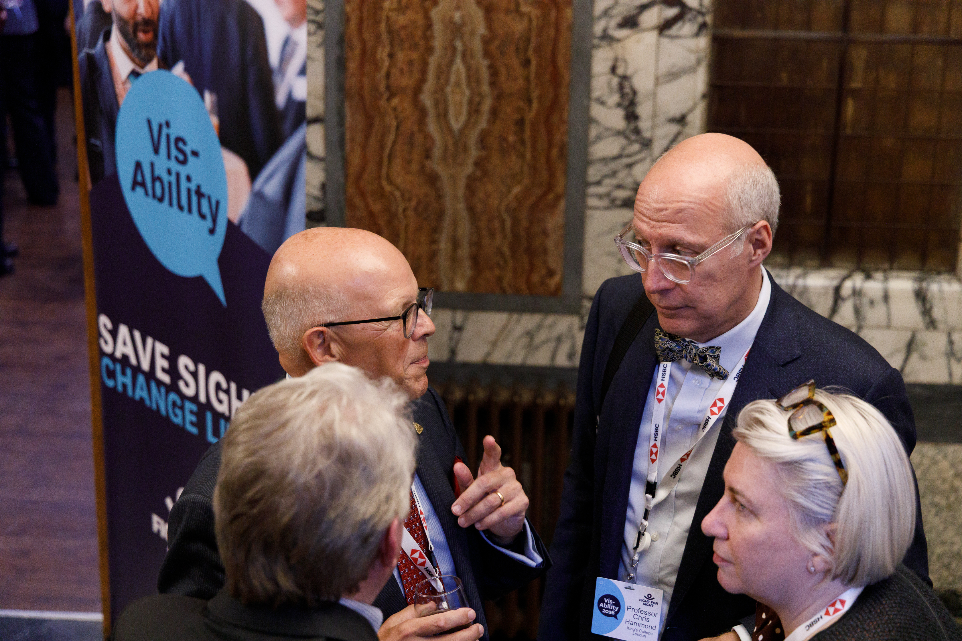 A group of people networking at Vis-Ability 2026