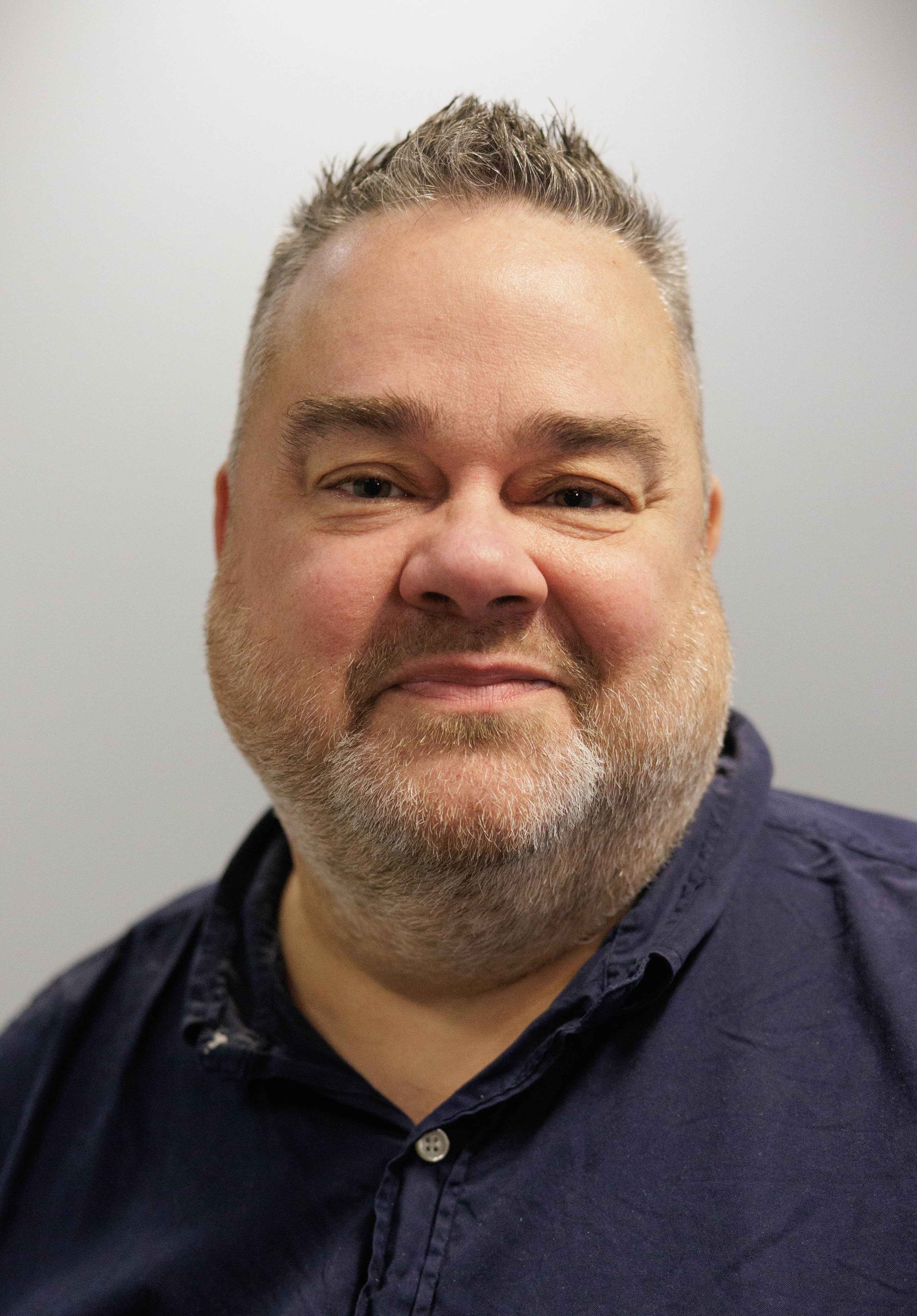 A headshot of Stephen Camps.