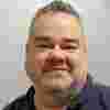 A headshot of Stephen Camps.