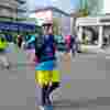 A Fight for Sight supporter smiling and giving the thumbs up while taking part in the Brighton Marathon