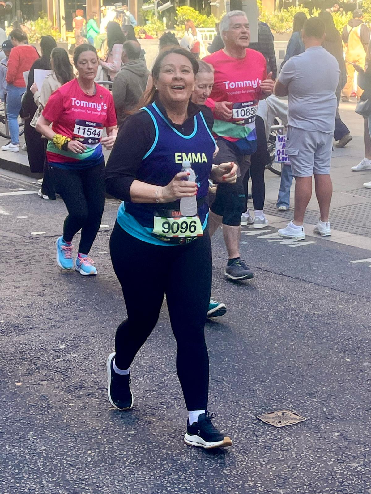 Emma Salisbury Running in the London Landmarks half marathon for Fight for Sight wearing black running leggings and a Fight for Sight vest