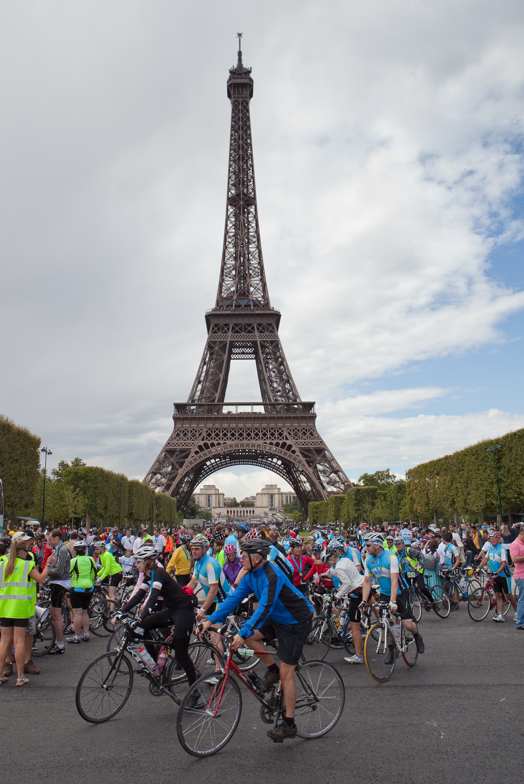 Hundreds of cyclists in front of the Eiffel Tower after completing the London to Paris cycle ride