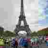 Hundreds of cyclists in front of the Eiffel Tower after completing the London to Paris cycle ride