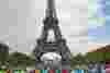 Hundreds of cyclists in front of the Eiffel Tower after completing the London to Paris cycle ride