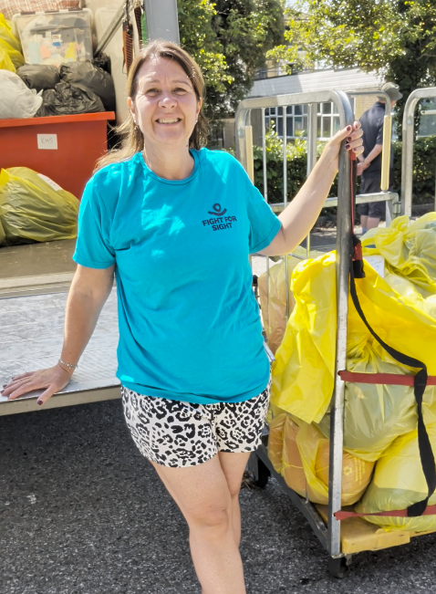 Emma Salisbury in a Fight for Sight tshirt by the Fight for Sight Van doing a charity Donation Drive to fund sight saving eye research