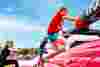 People climbing the inflatable obstacle run of Inflatable 5k