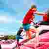 People climbing the inflatable obstacle run of Inflatable 5k