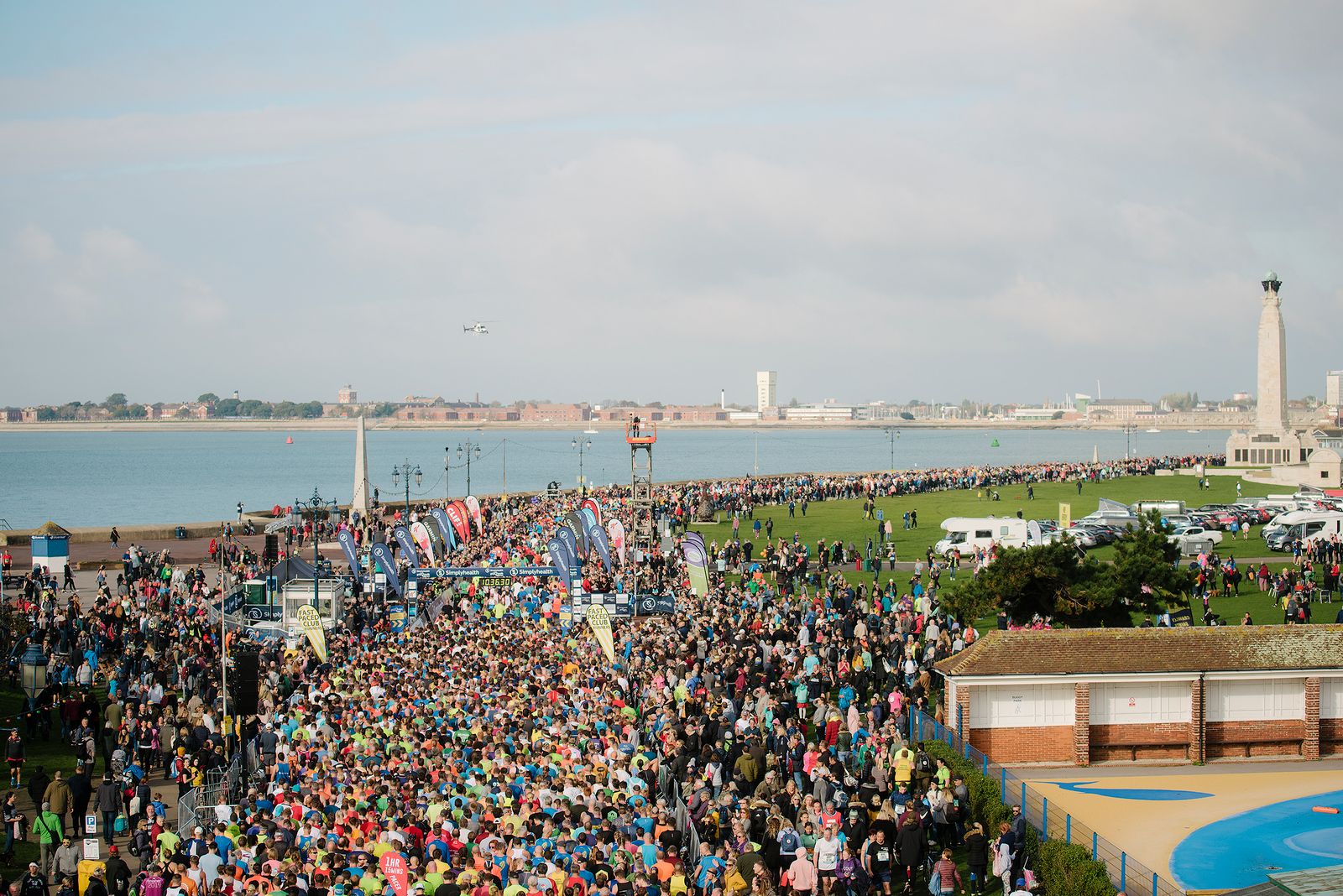 A sea of runners running past the waterfront