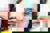 Two people standing close together. The image is framed so you can only see their eyes.