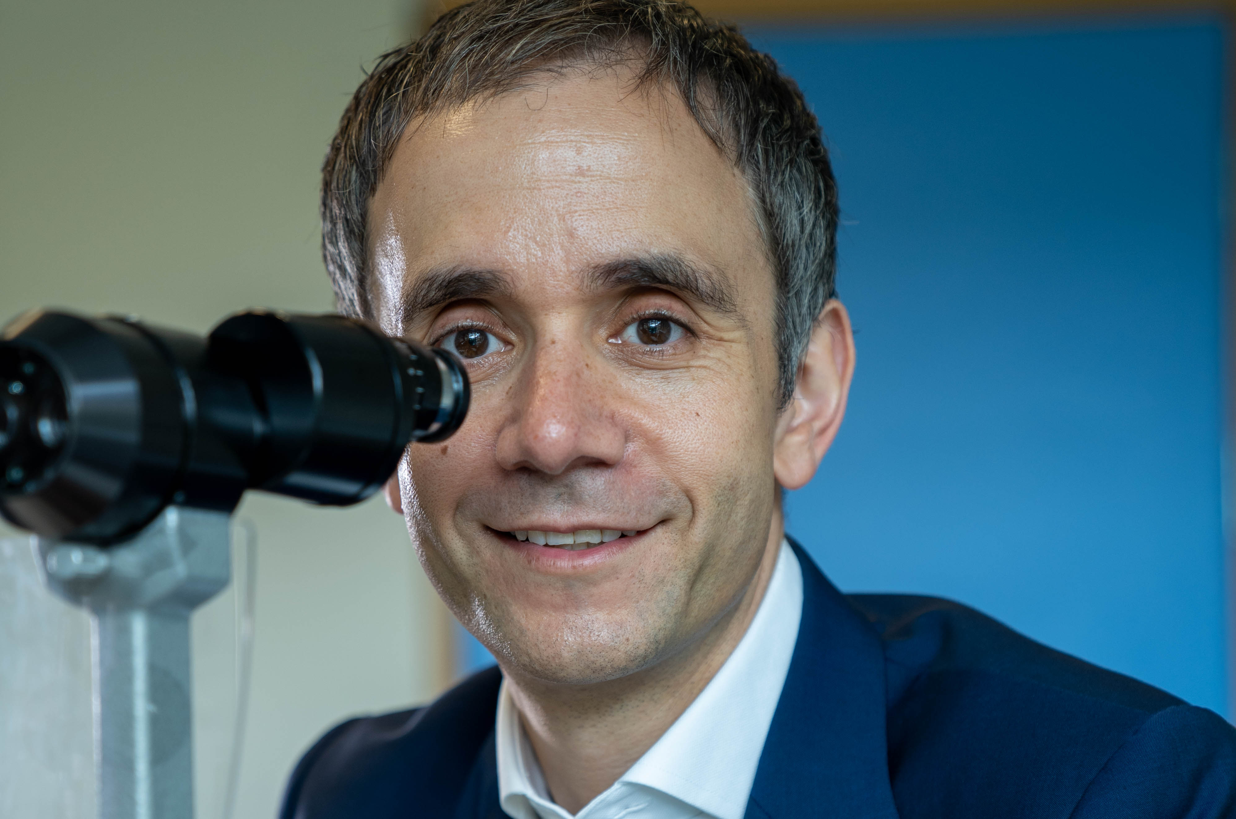 Professor Anthony Kwaja pictured behind an ophthalmic device