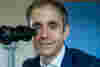 Professor Anthony Kwaja pictured behind an ophthalmic device