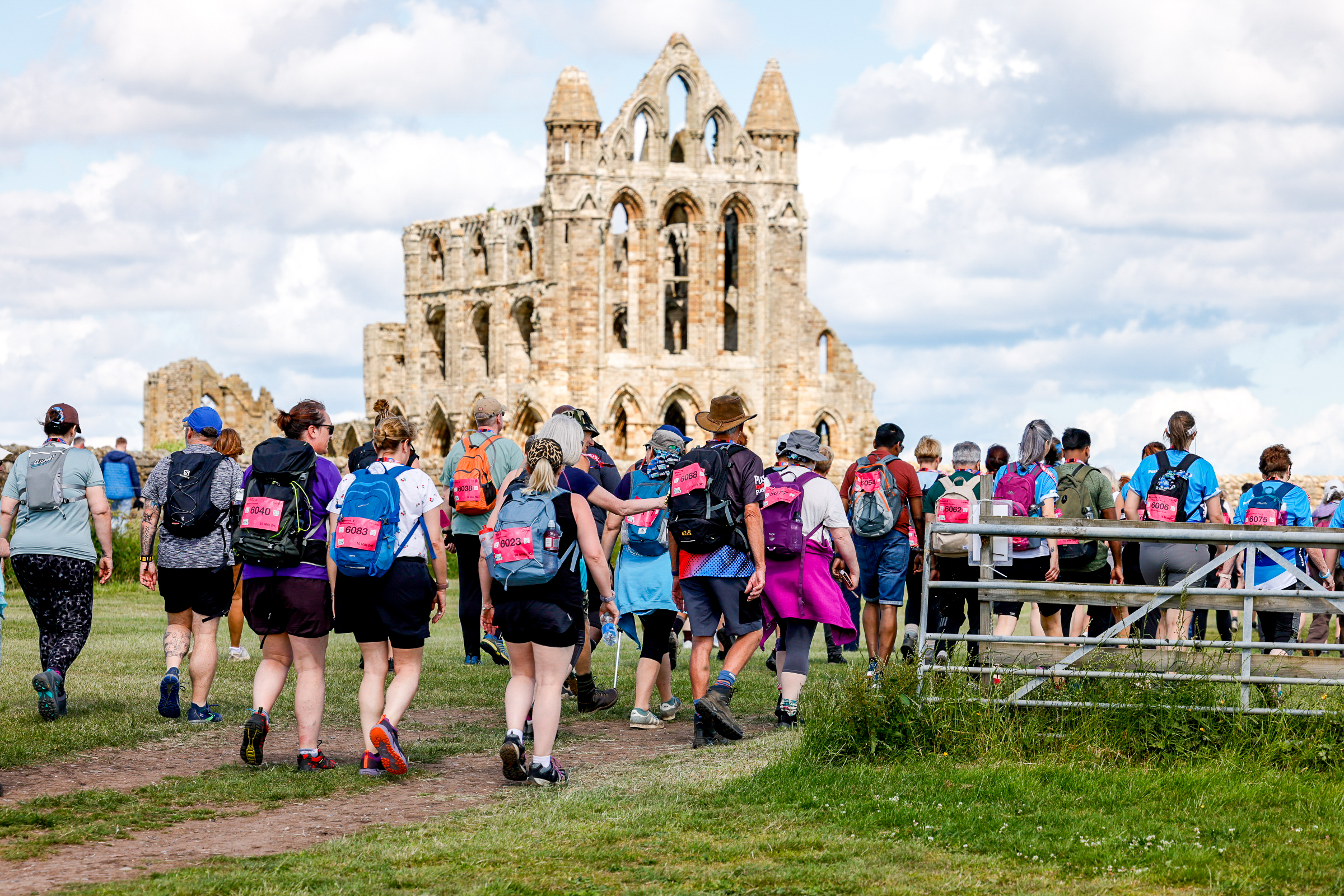 Walkers passing Whitby Abbey whilst taking part in the North Yorks Ultra Challenge
