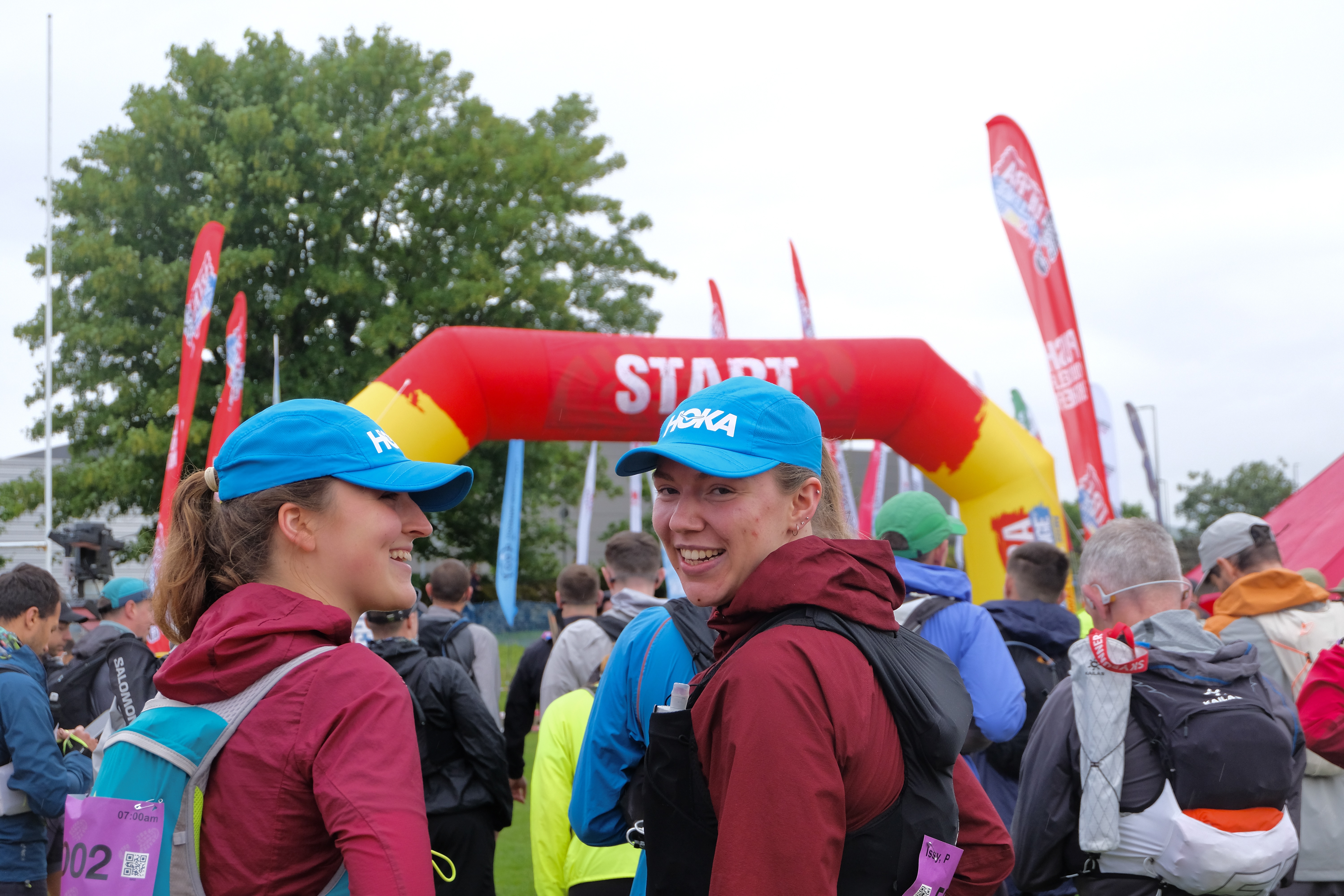 Two people smiling at the start line of the Lake District Challenge