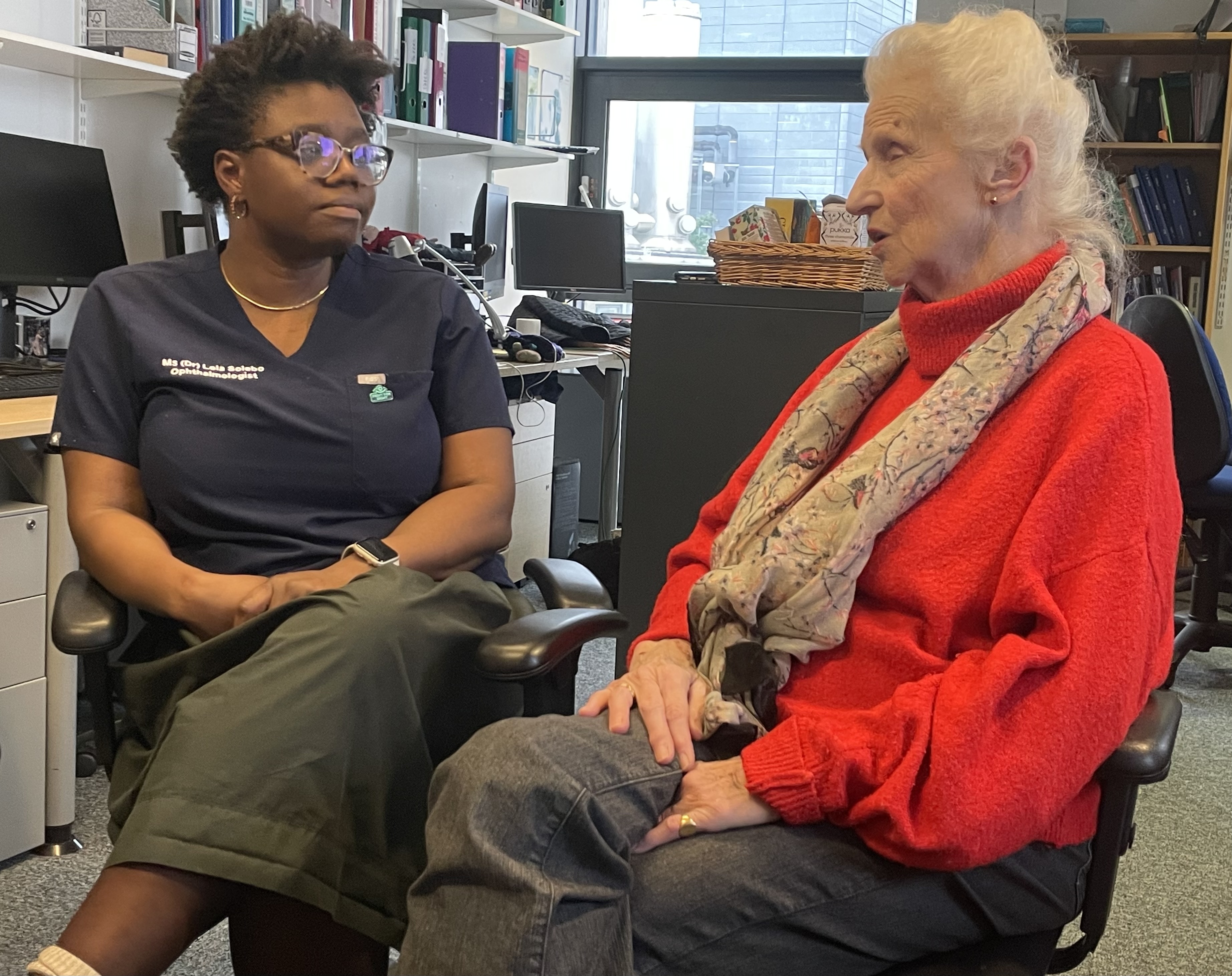 Dr Lola Solebo and Eizabeth Maxwell in conversation at Great Ormond Street Hospital. Dr Solebo is researching Uveitis with the support of a Fight for Sight Grant. Elizabeth, a Fight for Sight Fundraiser, is blind due to uveitis which she developed as a consequence of Juvenile Idiopathic Arthritis. 