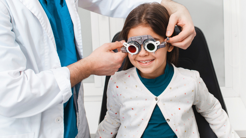 Young girl having an eye test