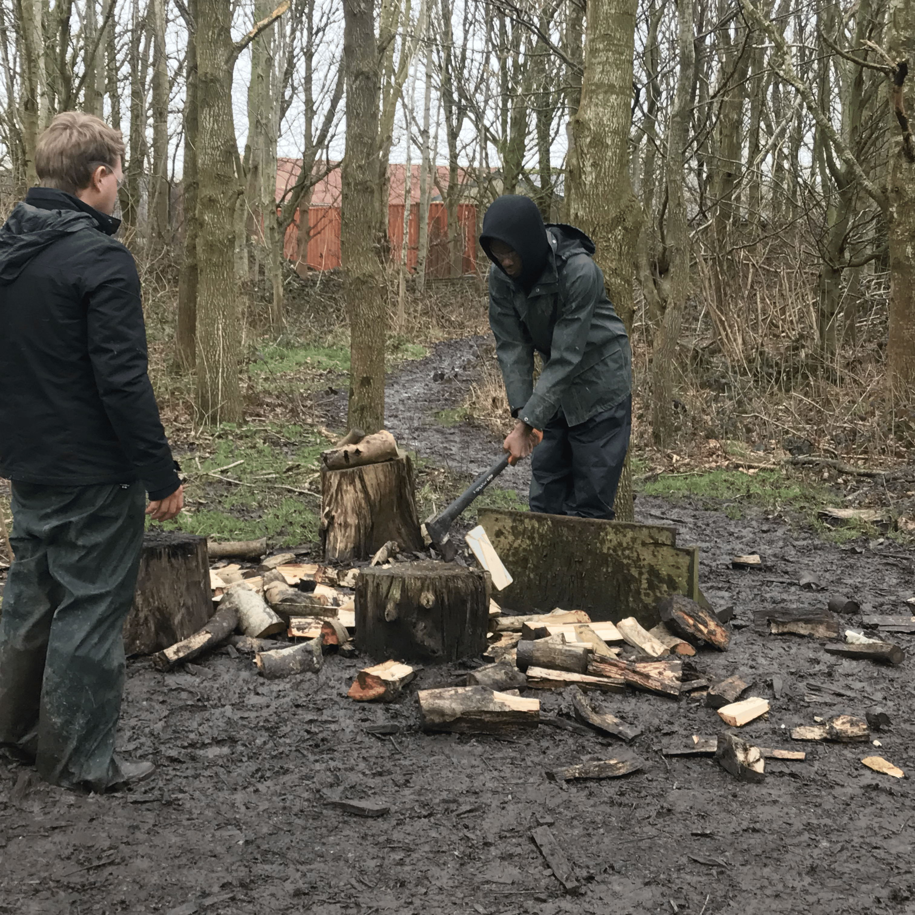 Joel chopping a log.