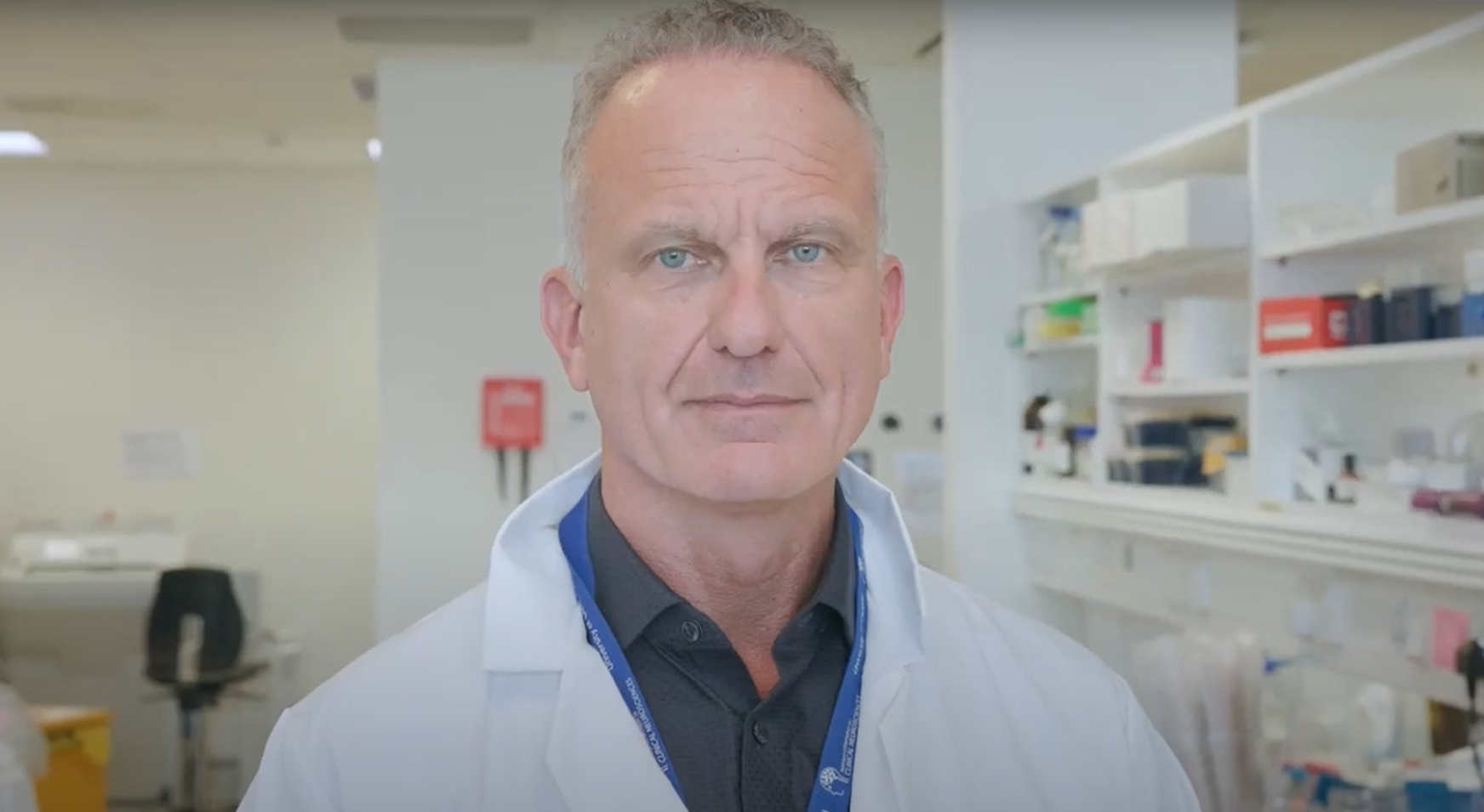 Professor Robert MacLaren in a white labcoat looking directly into the camera