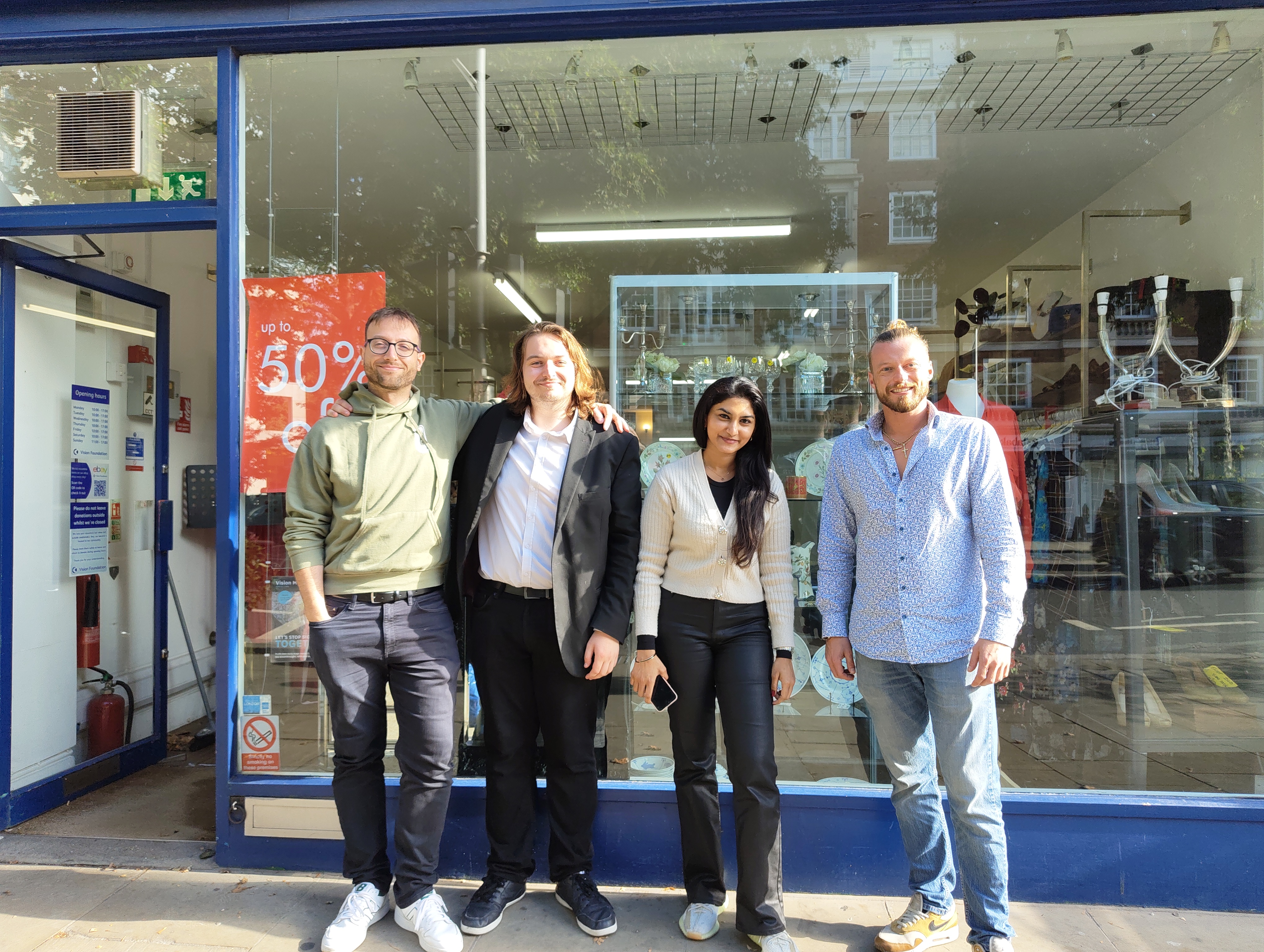 Three corporate volunteers and out Volunteering Manager outside of Kensington.