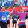 Pat and Laine cross the finish line at the Chicago Marathon, they're holding hands and smiling with joy