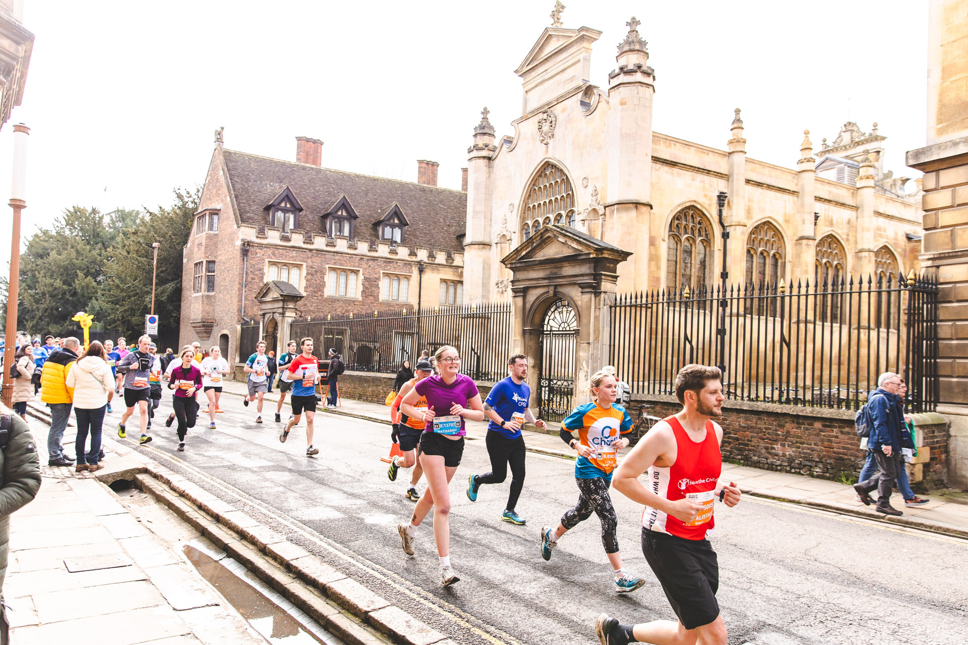 Runners taking part in the Cambridge Half Marathon and passing landmarks
