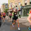 Smiling runners taking part in the Hackney Half Marathon