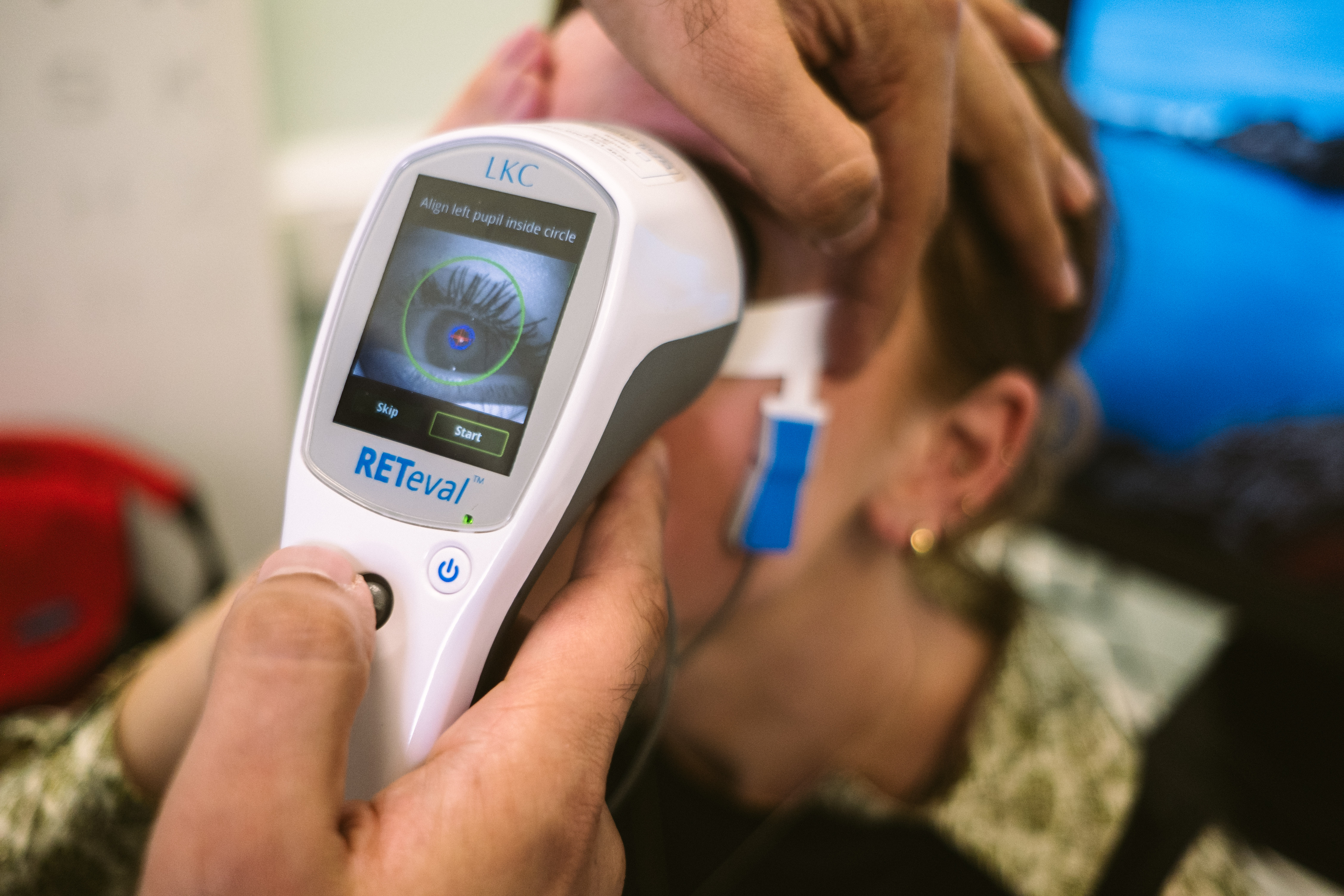 Close up of a person's eye viewed through a handheld scanner.