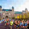 Runners taking part in the Amsterdam Marathon and passing the Rijksmuseum