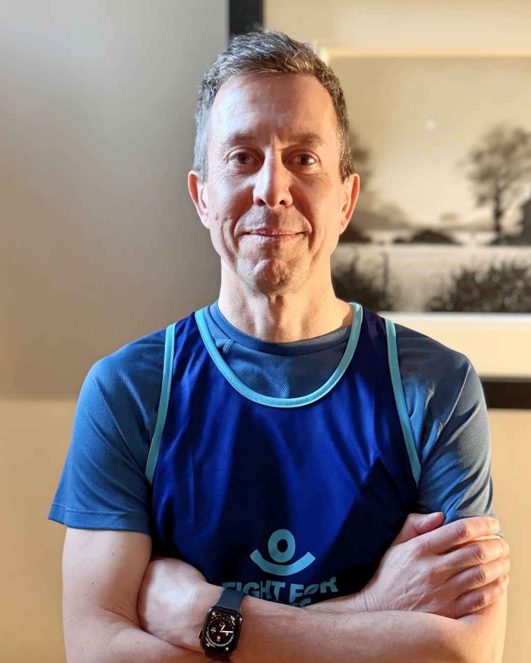 Daniel Broughton a man in his 50s wearing a Fight for Sight London Marathon Running vest, looking determined