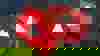 Two red blocks with a play symbol on them. The blocks overlap and are show from overhead. Together they symbolise that people can watch the webinar videos.