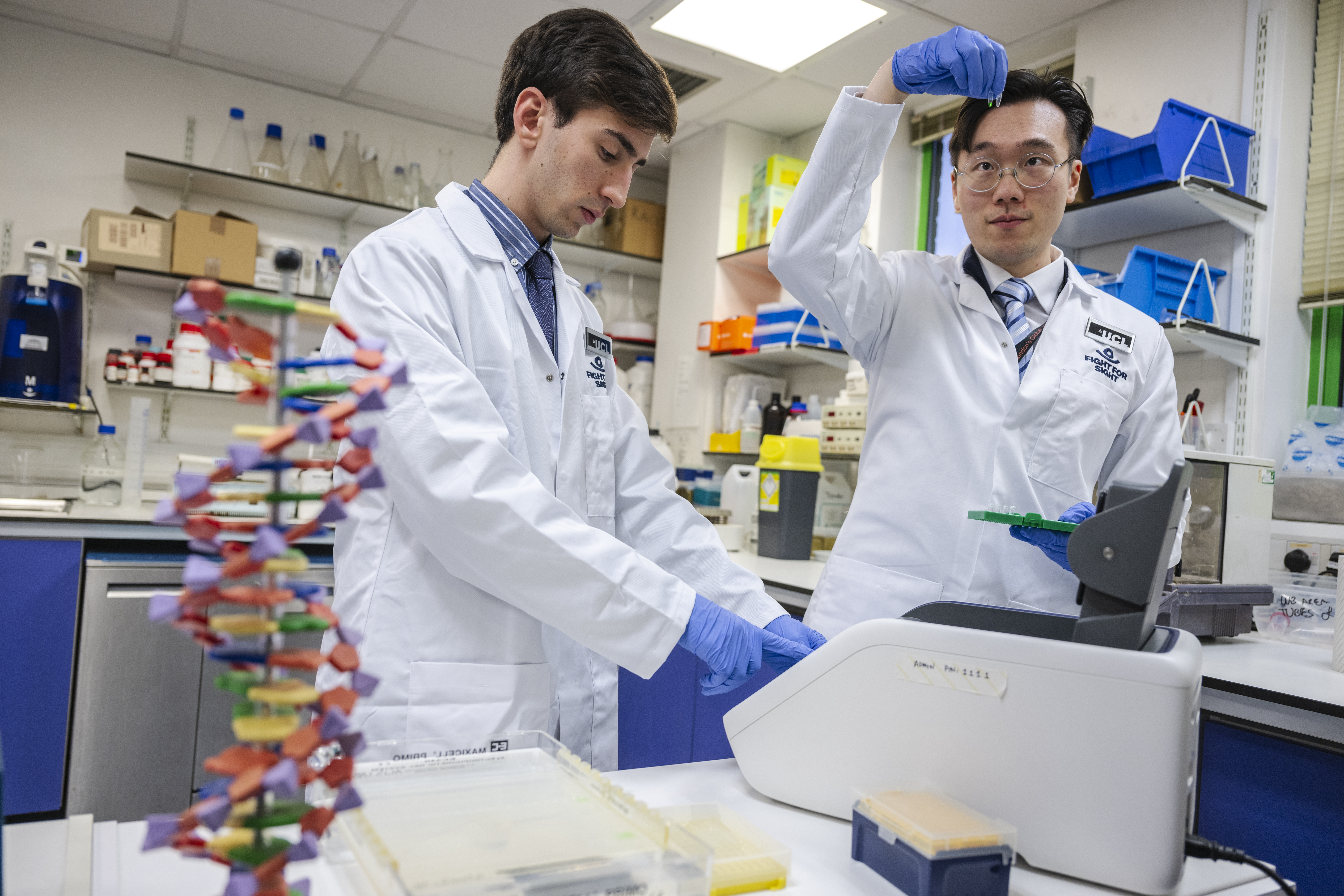 Two scientists doing science stuff 