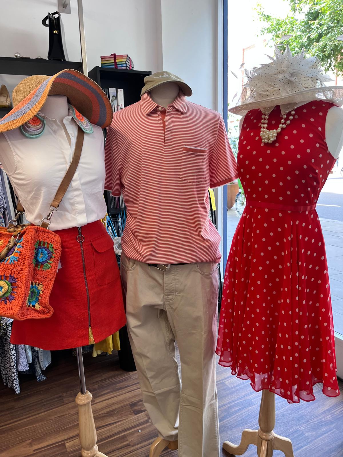 Three mannequins in a Fight for Sight charity shop